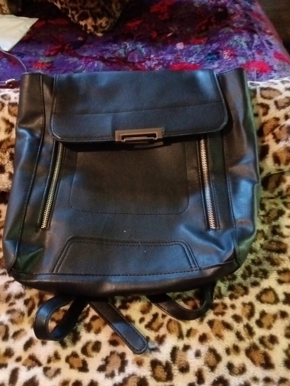 Minimalist Black Faux-Leather Backpack with Front Zip Detail